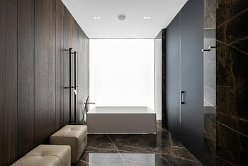spacious bathroom, modern bathroom, luxury finishes, leather poufs, sleek design, contemporary bathroom, spacious layout, marble flooring, minimalist design, luxury bathroom, modern interior