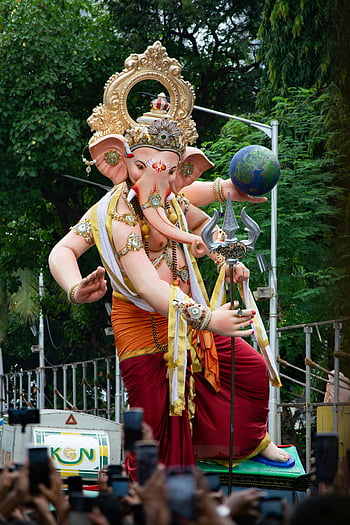 Ganesh Chaturthi, Mumbai, grand Ganesha idol, colorful street celebration, Antophill Cha Raja 2023, festival, Indian culture, religious event, traditional celebration, Ganesha statue, crowd gathering
