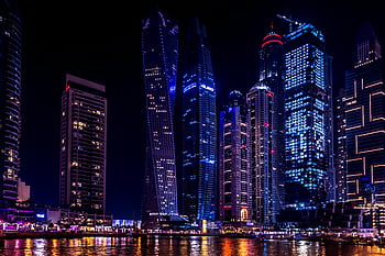 Dubai Marina, twisted building, nighttime, illuminated skyscrapers, water reflection, cityscape, urban architecture, modern buildings, night photography, waterfront, city lights