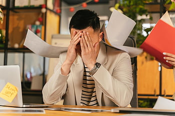 stressed businessman, paperwork, office environment, burnout, overwhelmed, work stress, desk, laptop, documents, office burnout, work overload