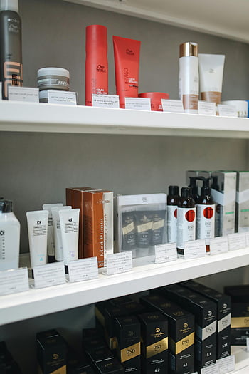skincare products, store shelves, beauty products, neatly displayed, variety of skincare, Med Planta, Wella Invigo, hair care products, cosmetic products, retail display, product shelves