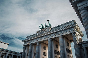 Brandenburg Gate, Berlin, Germany, historical architecture, dramatic sky, iconic landmark, European history, tourist attraction, neoclassical architecture, Berlin landmark, German history