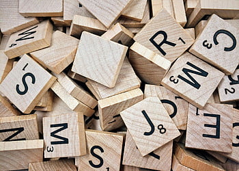 wooden Scrabble tiles, Scrabble letters, Scrabble numbers, stacked tiles, random arrangement, wooden tiles, Scrabble game, letter tiles, number tiles, Scrabble pieces, Scrabble board game