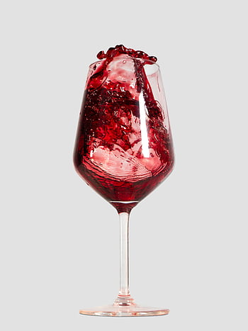 red wine, wine glass, vibrant splash, drinks advertising, white background, red liquid, wine movement, glassware, beverage photography, wine photography, wine splash
