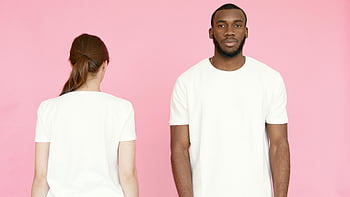 white t-shirt, pink background, front and back views, diverse models, casual wear, studio fashion shoot, minimalist design, unisex clothing, blank t-shirt, fashion photography, modern fashion