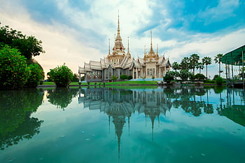 Thai temple, serene reflection, body of water, spirituality, culture, beautiful temple, Thai architecture, peaceful scene, water reflection, cultural landmark, spiritual place