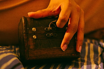 vintage wooden box, metal lock, striped fabric, close-up hand, brown wooden chest, antique chest, small treasure box, rustic box, hand holding box, vintage chest, metal hardware