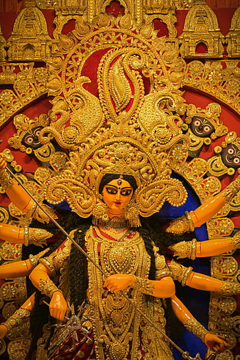 Majestic Durga Idol, Kolkata Durga Puja Festival, Intricate Durga idol, vibrant traditional artistry, Durga Puja, traditional art, Durga idol, Kolkata festival, golden idol, cultural festival, Indian festival