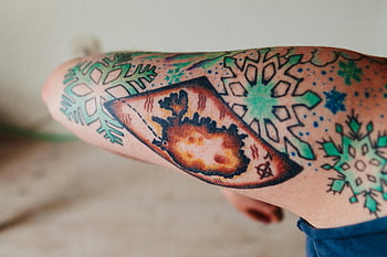 shoulder tattoo, snowflakes tattoo, arm tattoo, colorful tattoo, detailed tattoo, skin art, body art, tattoo design, winter tattoo, snowflake design, tattoo close-up
