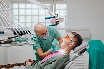 dentist, oral examination, dental check-up, experienced dentist, modern clinic, patient, dental chair, dental tools, dental hygiene, dental care, dental clinic