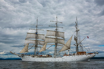 Gray Galleon Ship, classic sailing ship, Hol Norway, dramatic sky, water navigation, sailing vessel, maritime scene, ocean view, ship sails, nautical adventure, cloudy weather