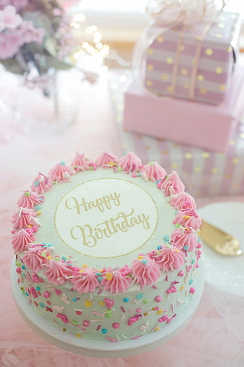 birthday cake, pink frosting, colorful sprinkles, close-up shot, happy birthday, celebrations, festive cake, party dessert, sweet treat, cake decoration, gift box