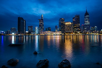 Ho Chi Minh City, Saigon River, cityscape, skyscrapers, night, city lights, urban skyline, Vietnam, waterfront, modern architecture, reflections