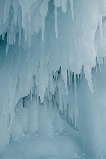 icicles, ice cave, close-up, frost-filled, winter beauty, stunning shot, hanging icicles, frosty environment, frozen landscape, icy formations, cave interior