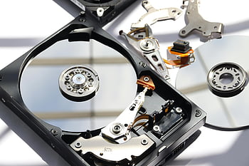 hard disk drive, HDD, disassembled HDD, internal components, close-up, detailed view, storage device, magnetic disk, data storage, computer hardware, platter