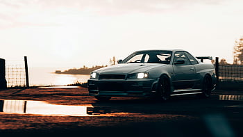Nissan Skyline, R34 Sportwagen, geparkt, Sonnenuntergang, Ozean, szenische Ansicht, Gewässer, Autofotografie, Automobil, Landschaft, Reflexion