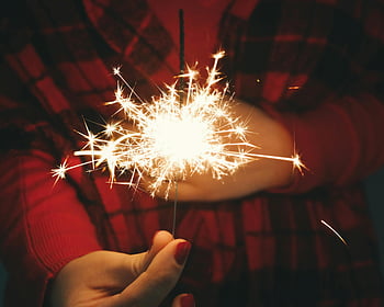 sparkler, hand holding sparkler, festive occasions, bright sparkler, dark background, person using firecracker, sparkler light, festive sparkler, sparkler celebration, sparkler photo, sparkler image
