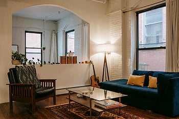 cozy living room, sofa, contemporary furniture, warm lighting, decorative elements, stylish living room, modern living room, comfortable seating, living room decor, cozy interior, living room furniture