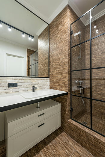 bathroom, sink, shower cabin, contemporary bathroom, sleek fixtures, modern bathroom, clean bathroom, stylish shower, wooden tiles, white vanity, black mirror