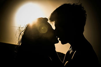 couple kissing, sunset silhouette, romantic scene, love moment, golden hour, romantic couple, sunset couple, kissing couple, romantic sunset, couple in love, romantic kiss