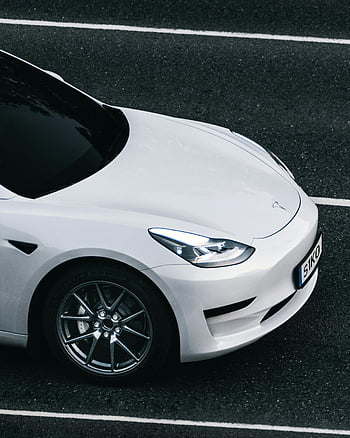 white Tesla, electric car, city street, Germany, top view, sleek design, white car, road, urban driving, modern vehicle, electric vehicle