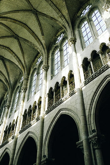 Gothic church interior, arched windows, intricate columns, stunning architecture, church design, religious building, Gothic style, interior design, historical architecture, church ceiling, stained glass windows