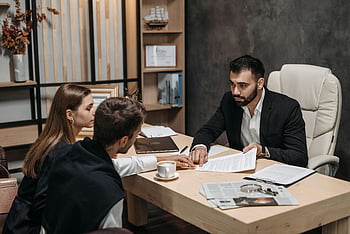 lawyer, legal documents, clients, office desk, man in black suit, discussing, professional meeting, business consultation, office setting, legal advice, document review