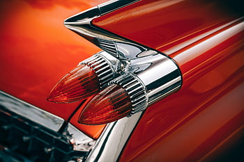 vintage tail lights, silver and red, retro car, chrome, vibrant colors, close-up, classic car, automotive design, tail light design, car details, vintage automotive