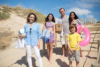 family beach outing, sunny day, summer fun, Portugal beach, family posing, beach activities, joyful family, beach vacation, family summer, beach photo, family beach photo