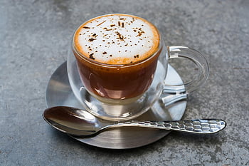 Frappucino, clear glass cup, cappuccino, frothy foam, sprinkled chocolate, metallic saucer, coffee drink, rich aroma, glass mug, coffee beverage, spoon