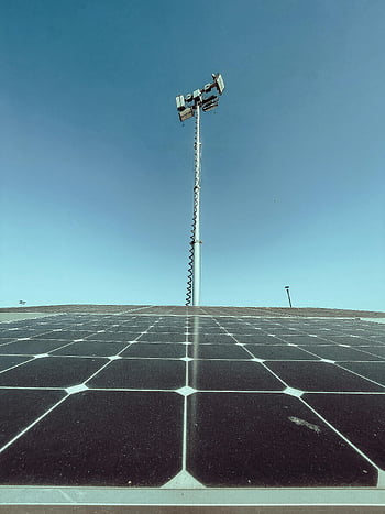 solar panels, blue sky, communication tower, clear sky, renewable energy, solar energy, outdoor scene, technology, sustainable energy, solar farm, solar power