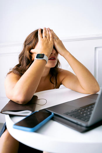 woman, covering face, stress, tiredness, hands on face, desk, laptop, work, fatigue, overwhelmed, office