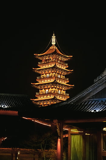 Tower Illuminated at Night, traditional Chinese pagoda, night sky, beautifully lit, pagoda, night photography, architectural lighting, cultural landmark, historic structure, night scene, illuminated tower