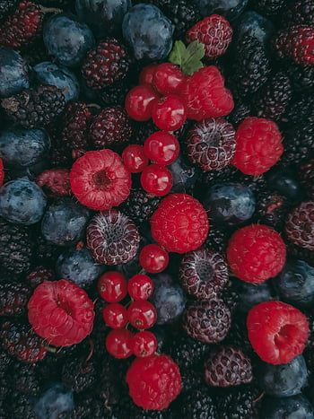 heap of assorted berries, fresh mixed berries, raspberries, blackberries, blueberries, healthy eating, close-up berries, vibrant berries, fruit assortment, organic berries, berry mix