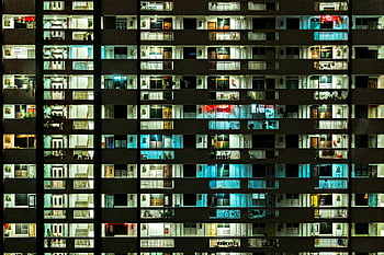 room balconies, night view, modern apartment building, illuminated windows, urban life, cityscape, apartment interiors, night photography, urban architecture, residential building, city lights