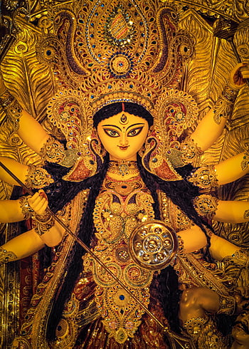 Durga Puja, Durga idol, cultural heritage, Kolkata, India, exquisite art, rich culture, goddess Durga, traditional festival, golden idol, decorative art