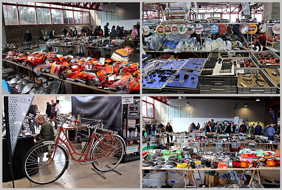 classic car parts, vintage vehicles, automotive accessories, bicycle, indoor market, people shopping, car lights, car emblems, car mirrors, car bumpers, car wheels